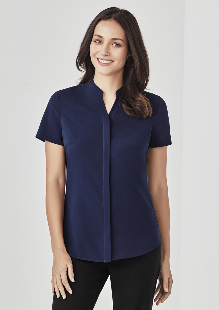 Image of a woman wearing a smart casual corporate uniform.