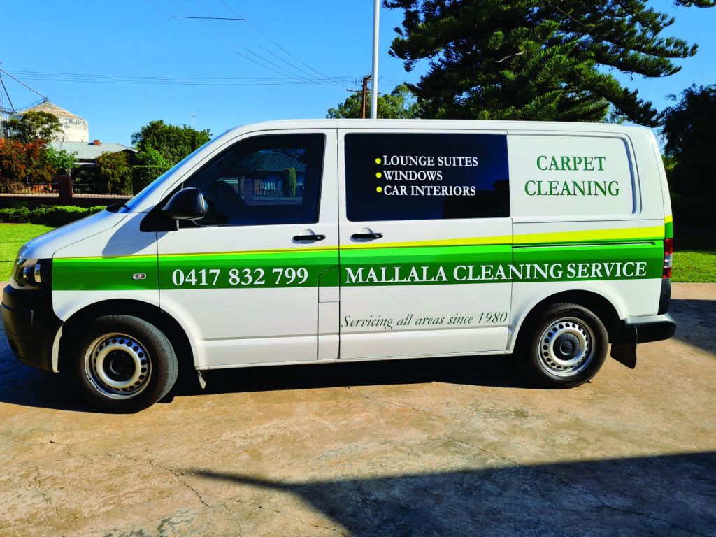 Image of signage on the side of a van.